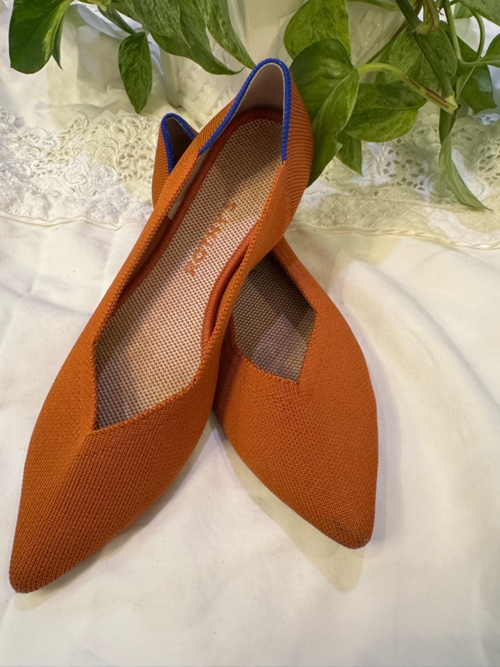 Rothy's Pointed Knit Flats in Burnt Orange with Blue Trim